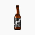 Bouteille de bière Coreff Brune Pur Malt à étiquette noire et capsule dorée